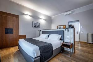 Posteľ alebo postele v izbe v ubytovaní Antico Centro Suite