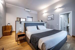 Posteľ alebo postele v izbe v ubytovaní Antico Centro Suite