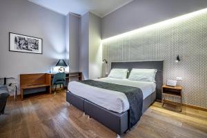 Posteľ alebo postele v izbe v ubytovaní Antico Centro Suite