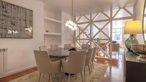 a dining room with a table and chairs at LovelyStay - Chiado 3Bedroom Wonder in Lisbon