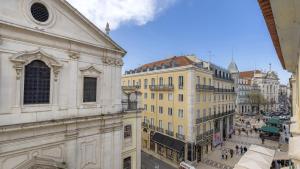 a view of a street in a city with buildings at LovelyStay - Chiado 3Bedroom Wonder in Lisbon