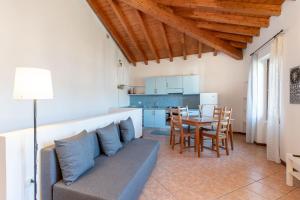 a living room with a couch and a table at JAM Apartments in Malcesine