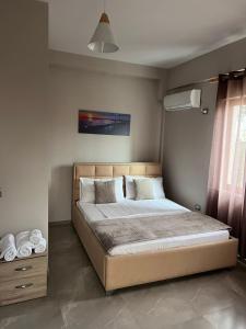 a bedroom with a bed in a room at Serene Stay in Vlorë