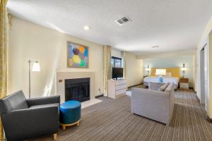 a hotel room with a bed and a fireplace at Avia Residences on Savoy - Extended Stay in Atlanta