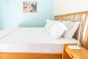A bed or beds in a room at Iris Villas Lefkada - Karavi Villa with private sea access