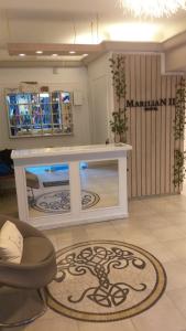 a counter in a room with a table at Hotel Marilian II in Salta