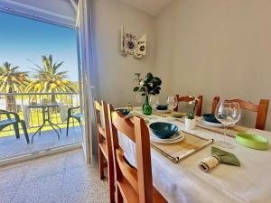 a dining room with a table with a view of the ocean at La Esteluca - 6805 in Noja