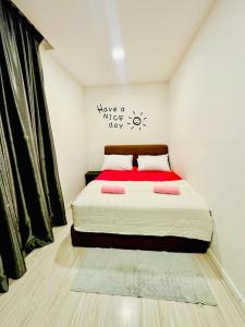 a bedroom with a large bed with a red blanket at Sutera Luxurious Loft 1 in Kota Kinabalu