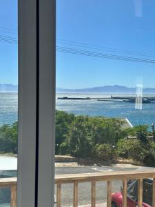 a view of the ocean from a balcony at Blue Bay Studio Bayview in Cape Town