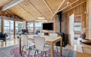 a dining room with a table and chairs at Stunning Home In Sjlund With Kitchen in Sjølund