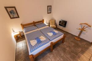 Postel nebo postele na pokoji v ubytování Apartmány Modrá Vrata