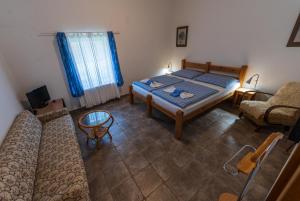 Postel nebo postele na pokoji v ubytování Apartmány Modrá Vrata