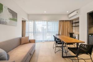 a living room with a couch and a table at LV Puerto Madero in Buenos Aires