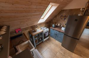 Kuchyň nebo kuchyňský kout v ubytování Apartmány Modrá Vrata