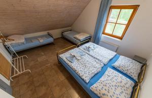 Postel nebo postele na pokoji v ubytování Apartmány Modrá Vrata