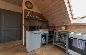 Kuchyň nebo kuchyňský kout v ubytování Apartmány Modrá Vrata
