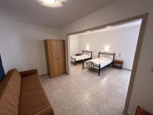 A bed or beds in a room at Sfinias Apartments