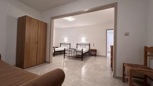 A bed or beds in a room at Sfinias Apartments