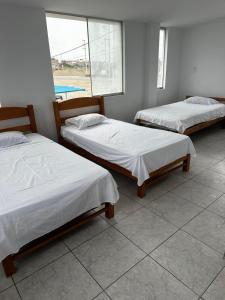 Postel nebo postele na pokoji v ubytování YOLO House Peru