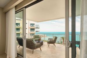 a living room with a view of the ocean at The Residences at The St. Regis Bermuda in Saint George