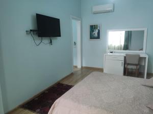 TV o dispositivi per l'intrattenimento presso Hotel & Restaurant White City
