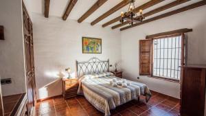 Posteľ alebo postele v izbe v ubytovaní Casa Rosario Almachar by Ruralidays