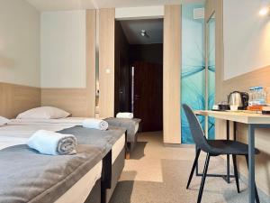 Posteľ alebo postele v izbe v ubytovaní Hotel Turkus
