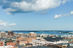 a view of a city with buildings and the ocean at The Westin Portland Harborview in Portland