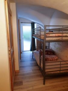 a hallway with two bunk beds in a room at Maison de 3 chambres avec jardin clos a Chateauneuf d'Oze 