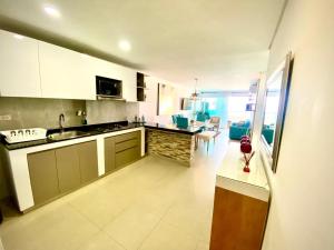 Kuchyň nebo kuchyňský kout v ubytování Torres del lago Pegasus Group Cartagena