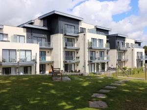 a large building with a grass yard in front of it at The Bay in Sandown
