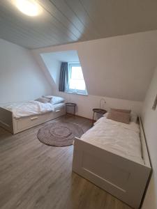 Posteľ alebo postele v izbe v ubytovaní LütjeFöhr