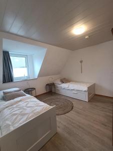En eller flere senge i et værelse på LütjeFöhr