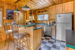 a kitchen with a counter and a refrigerator at Sno-Bird #10 in Government Camp
