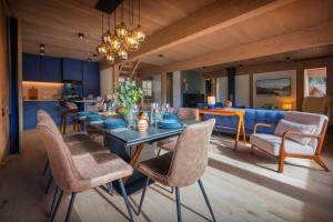 a dining room with a table and chairs at Chalet Ours Rouge - OVO Network in Le Grand-Bornand