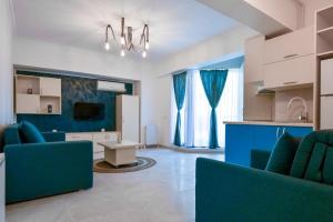 Μια τηλεόραση ή/και κέντρο ψυχαγωγίας στο PAONI Apartment & Studio by Solid Residence Butoaie Mamaia