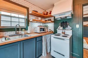 a kitchen with a sink and a stove top oven at Chic Elizabethtown Apartment Walk to Downtown! in Elizabethtown