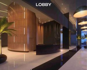a lobby of a building with a palm tree at Loft moderno e Hi- tech Vertigo in Campo Grande +25 photos