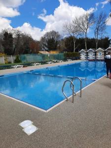 a large swimming pool with blue water at WILD DUCK HAVEN RESORT in Belton