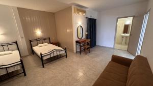 A bed or beds in a room at Sfinias Apartments