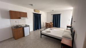 A bed or beds in a room at Sfinias Apartments Még 37 kép