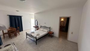A bed or beds in a room at Sfinias Apartments