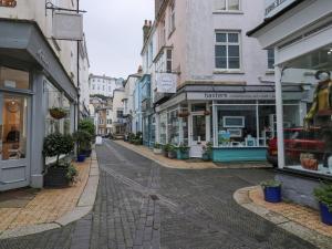 an empty city street with shops and buildings at 8 Charles Street in Dartmouth