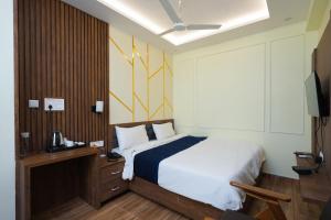 Posteľ alebo postele v izbe v ubytovaní Hotel Pavitra