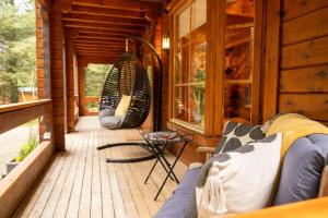 Posezení v ubytování Large Luxury Log Cabin Getaway