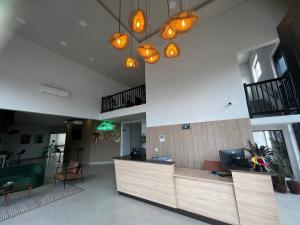 a lobby with a reception desk in a building at Hotel da Vila in Vila Bela da Santíssima Trindade