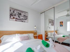 A bed or beds in a room at Marina Duplex by Hello Homes Sitges Még 28 kép