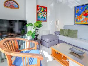 A television and/or entertainment centre at Marina Duplex by Hello Homes Sitges