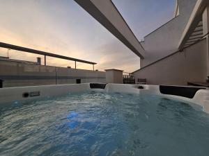 a hot tub on the roof of a house at Centre-Terrace, Pool, Parking & Home-Office (WIFI) in Tarifa