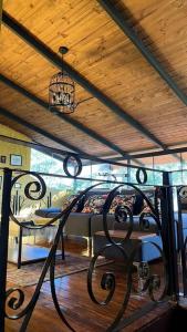 a dining room with a table and a chandelier at Casa de campo - Fundo El Alisal in Cajamarca